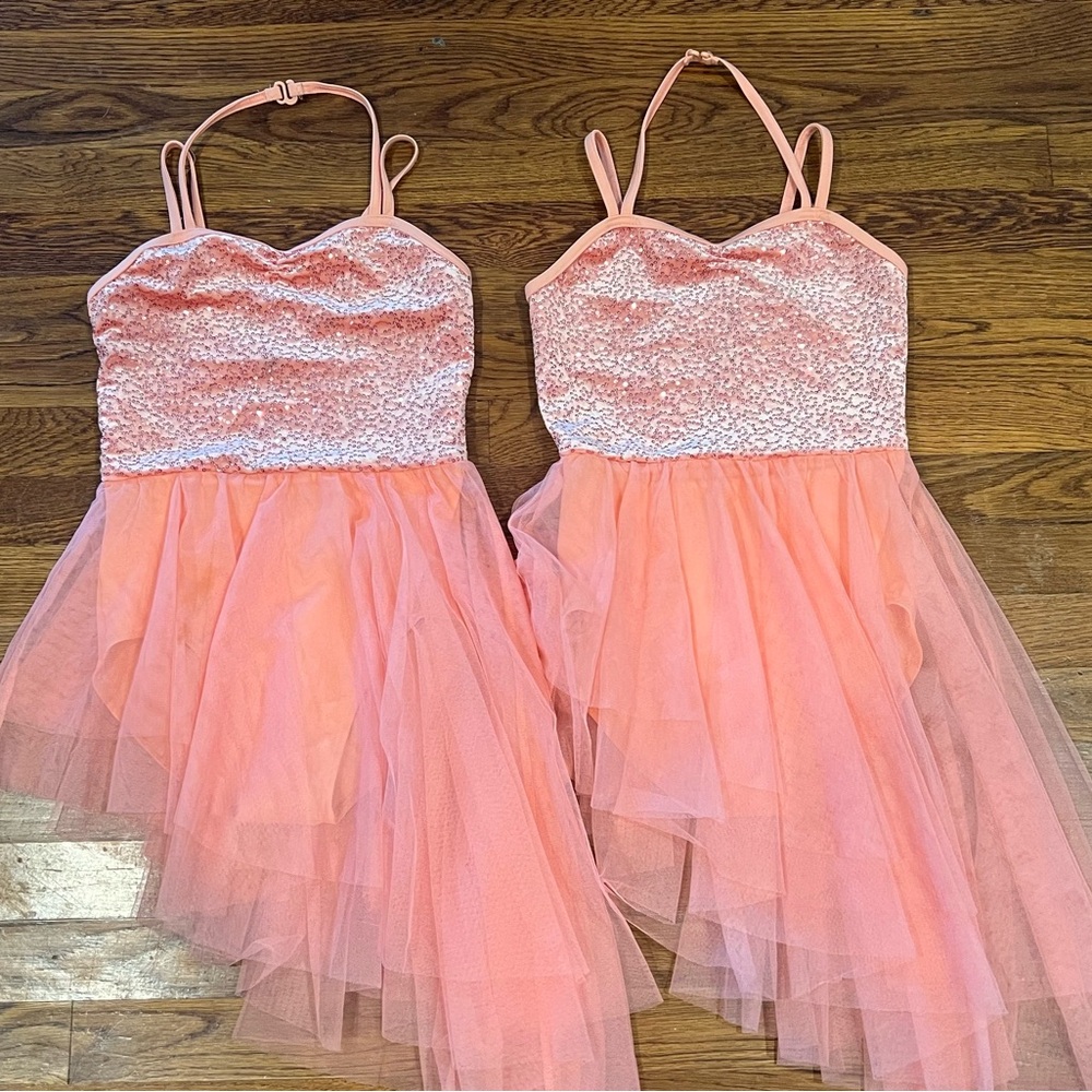 (2) girls dance costumes. Peach/ coral color